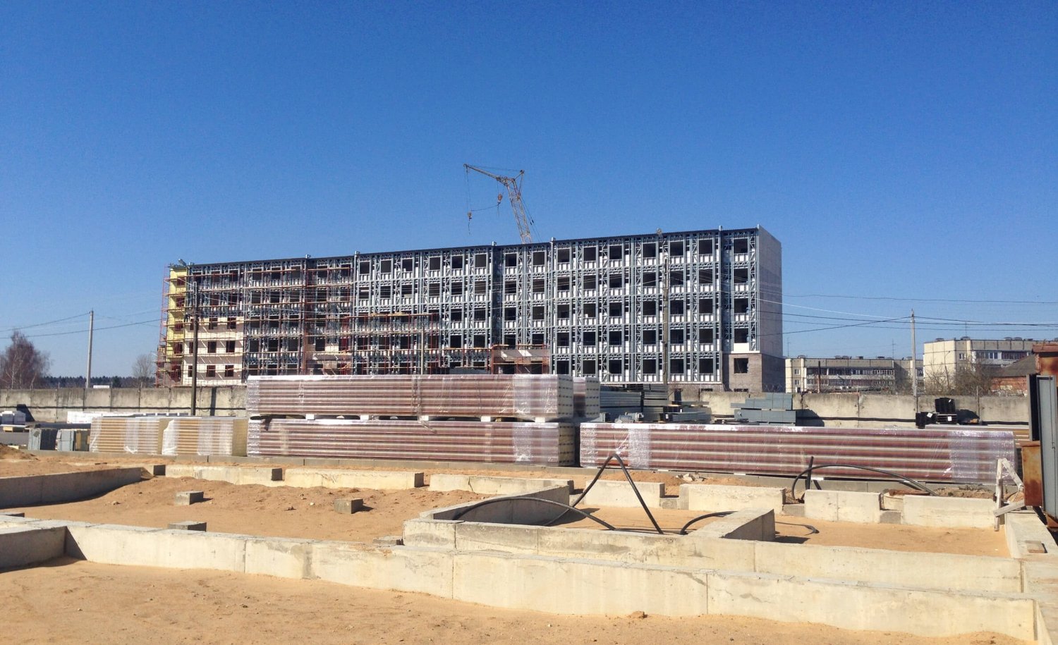 Mixed use (office / storage warehouse) multi-storey light steel frame building under construction in Russia.